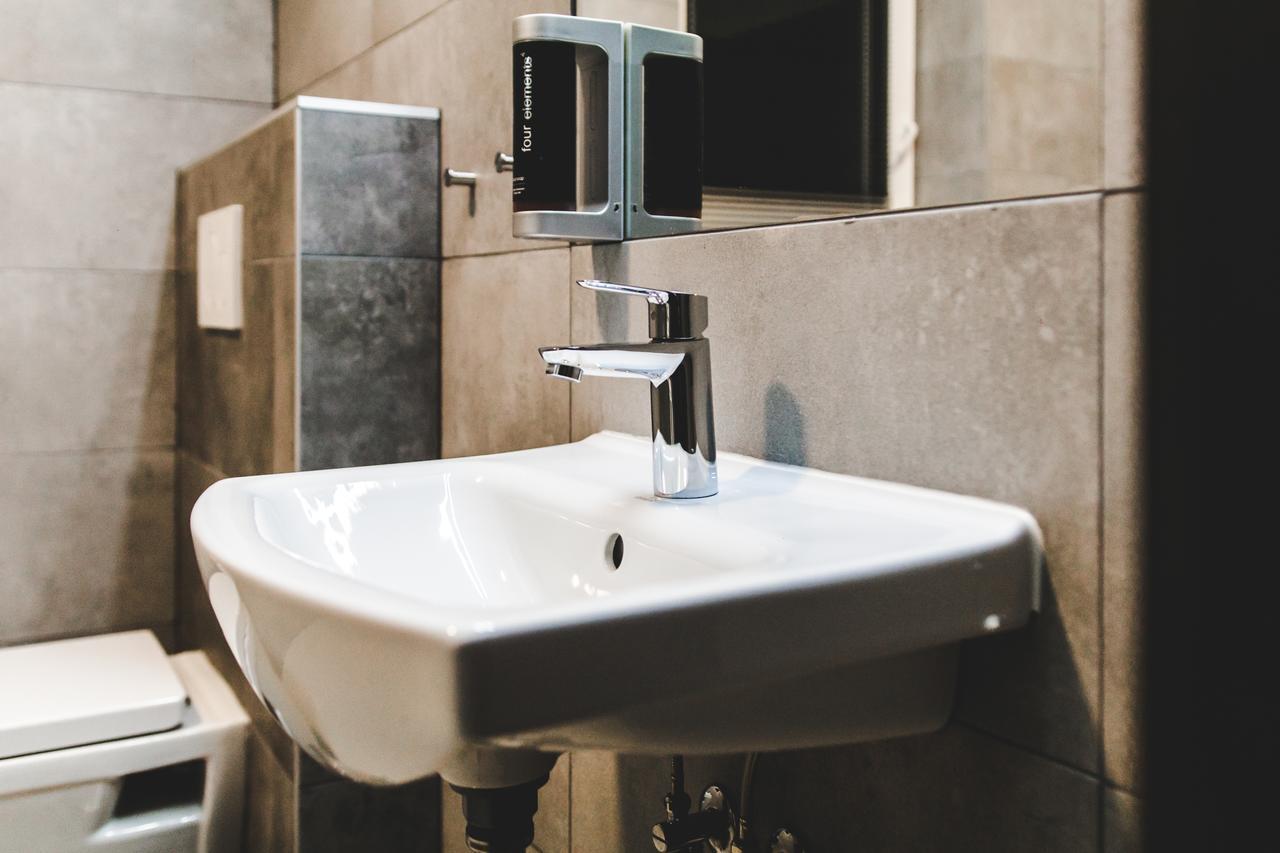 Silesia Residence Ostrava Luaran gambar A soap dispenser mounted above a sink